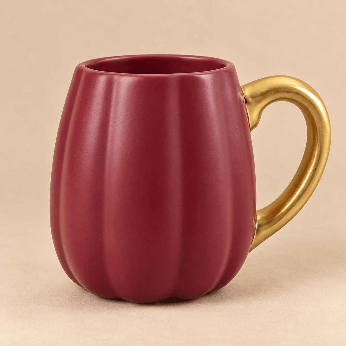  elegant burgundy ceramic coffee mug with a luxurious gold handle 